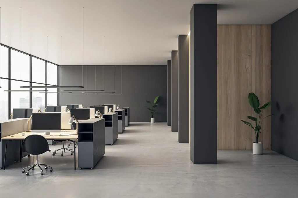 Contemporary coworking office interior with equipment, furniture and panoramic window with city view. 3D Rendering